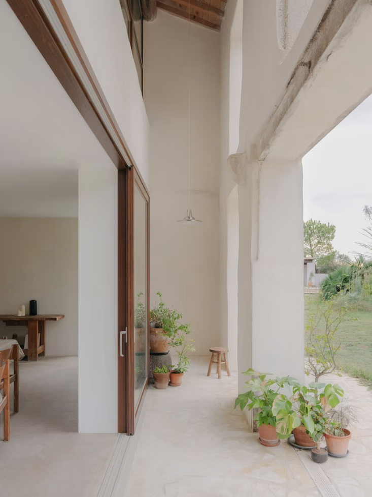 Indoor-outdoor living, French style. Photograph by Jean-Baptiste Thiriet courtesy of Pareil, from Bioclimatique: An Arles Farmhouse-Turned-Artist Residency with Sustainability in Mind.